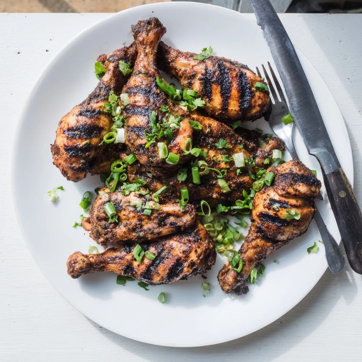 Golden brown Jamaican Jerk Chicken with charred grill marks and spicy marinade glistening
