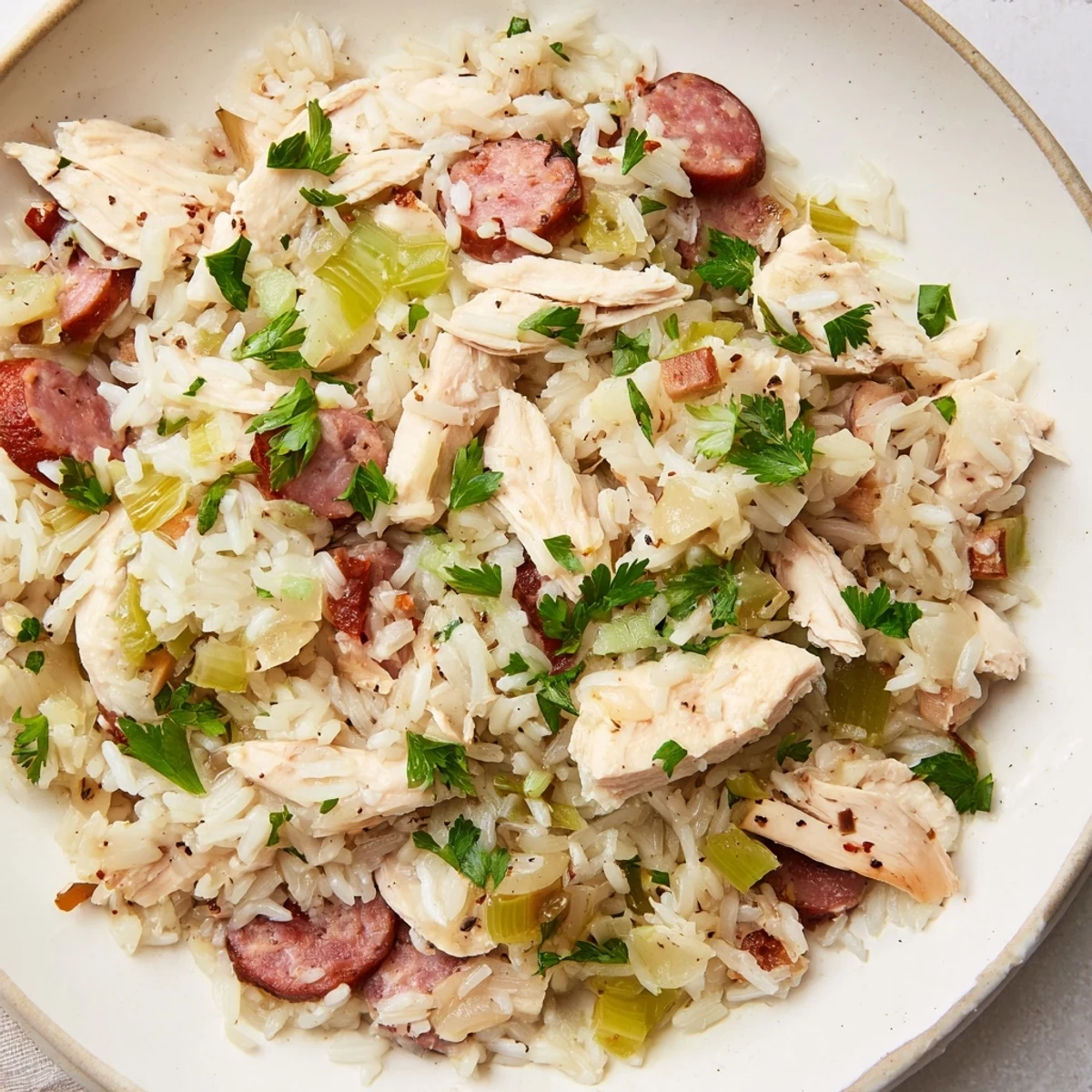 Savory Southern Chicken Bog steaming in a Dutch oven with moist rice absorbing rich chicken broth flavors