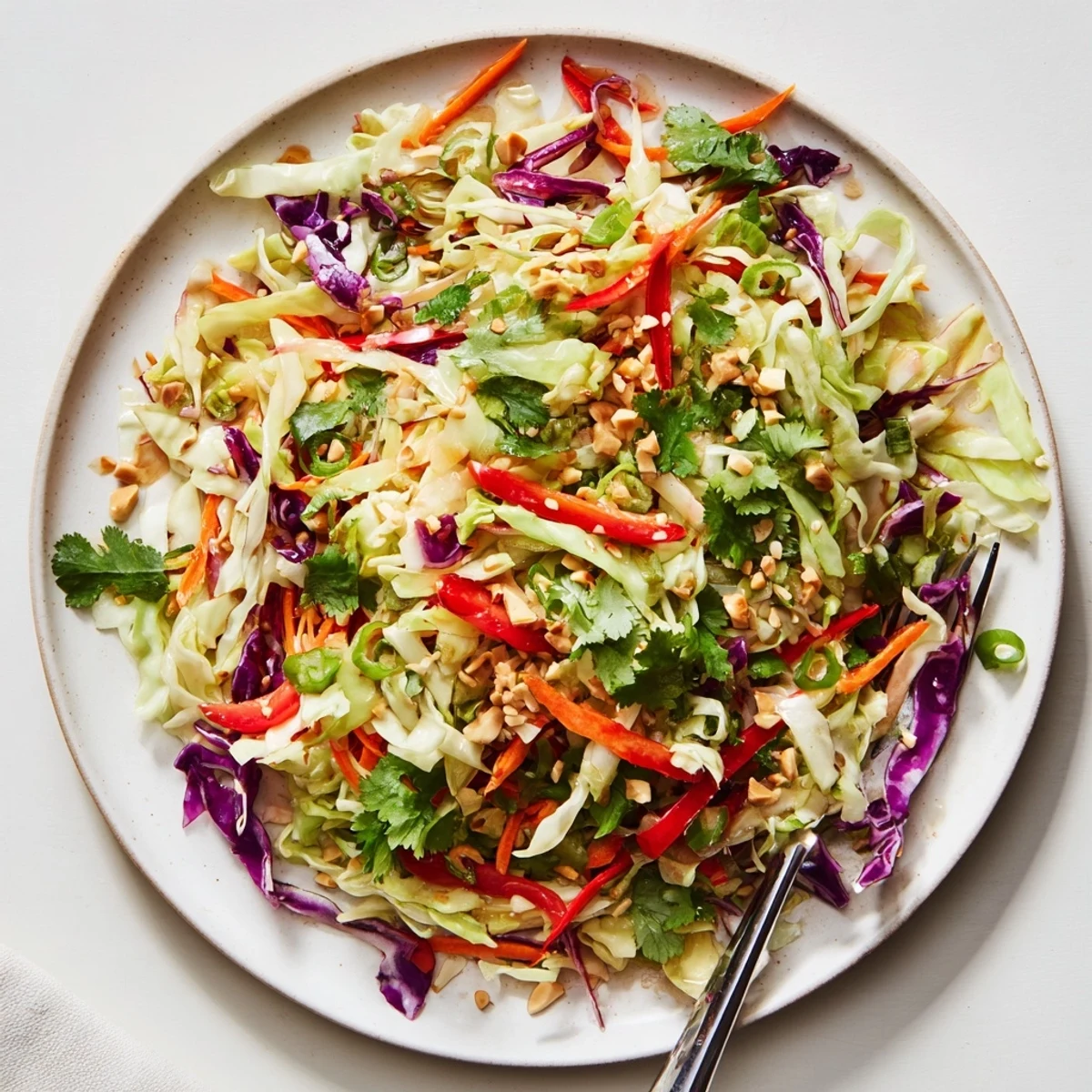 Asian Cabbage Salad with crunchy cabbage, bright peppers, and tangy sesame dressing.