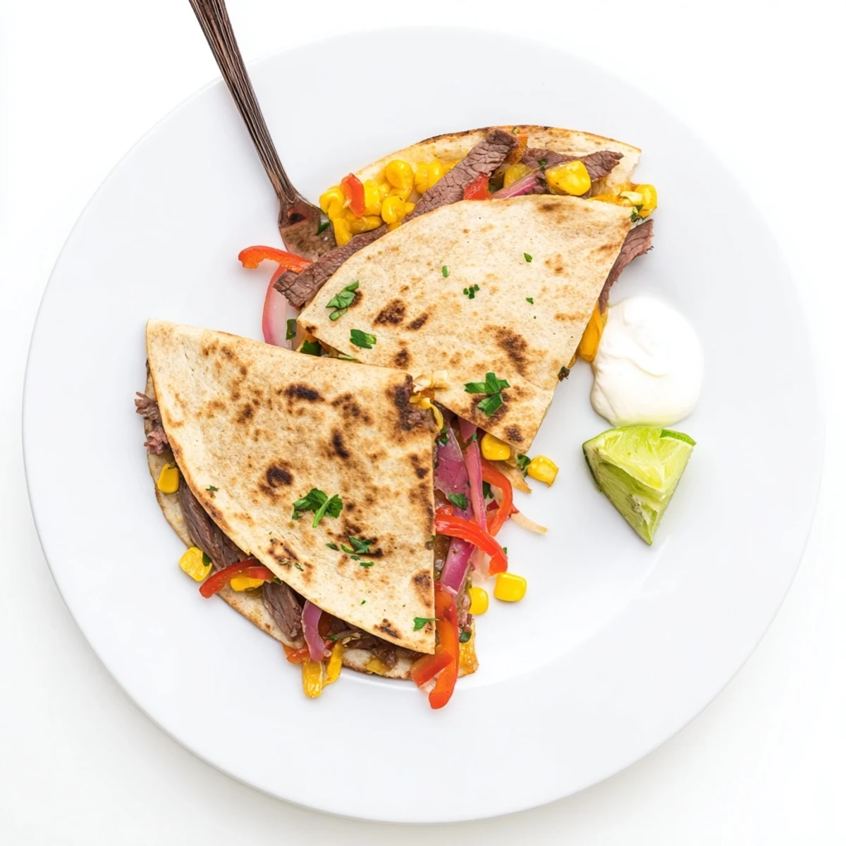 Sweet Savory Beef Quesadillas Recipe: golden crisp tortillas filled with tender, glazed beef.