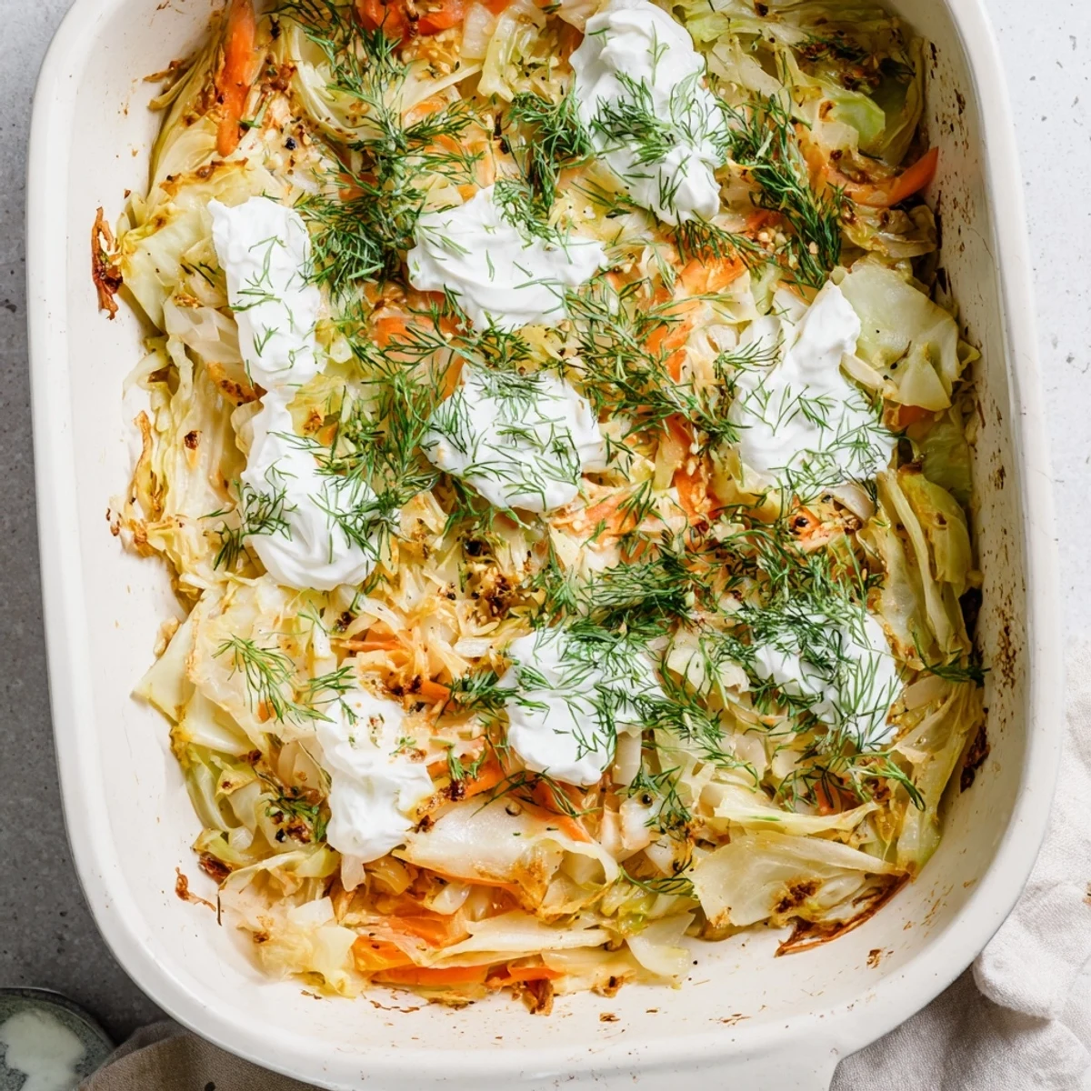 Comforting slow roasted cabbage and sauerkraut casserole served piping hot with crusty bread on the side